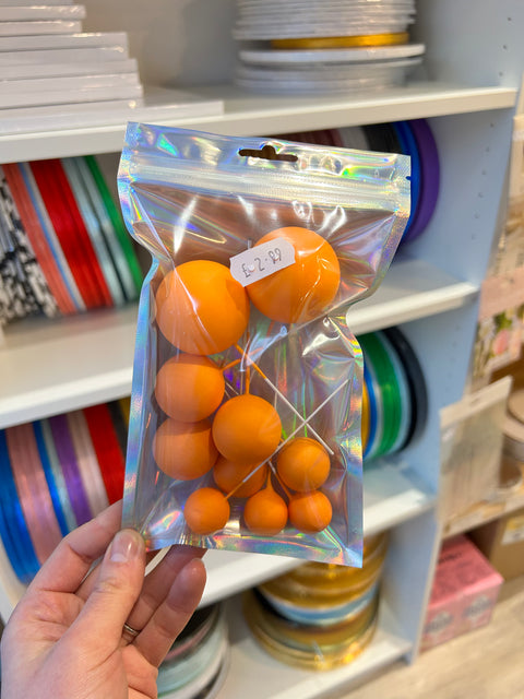 Orange Balls on Wires